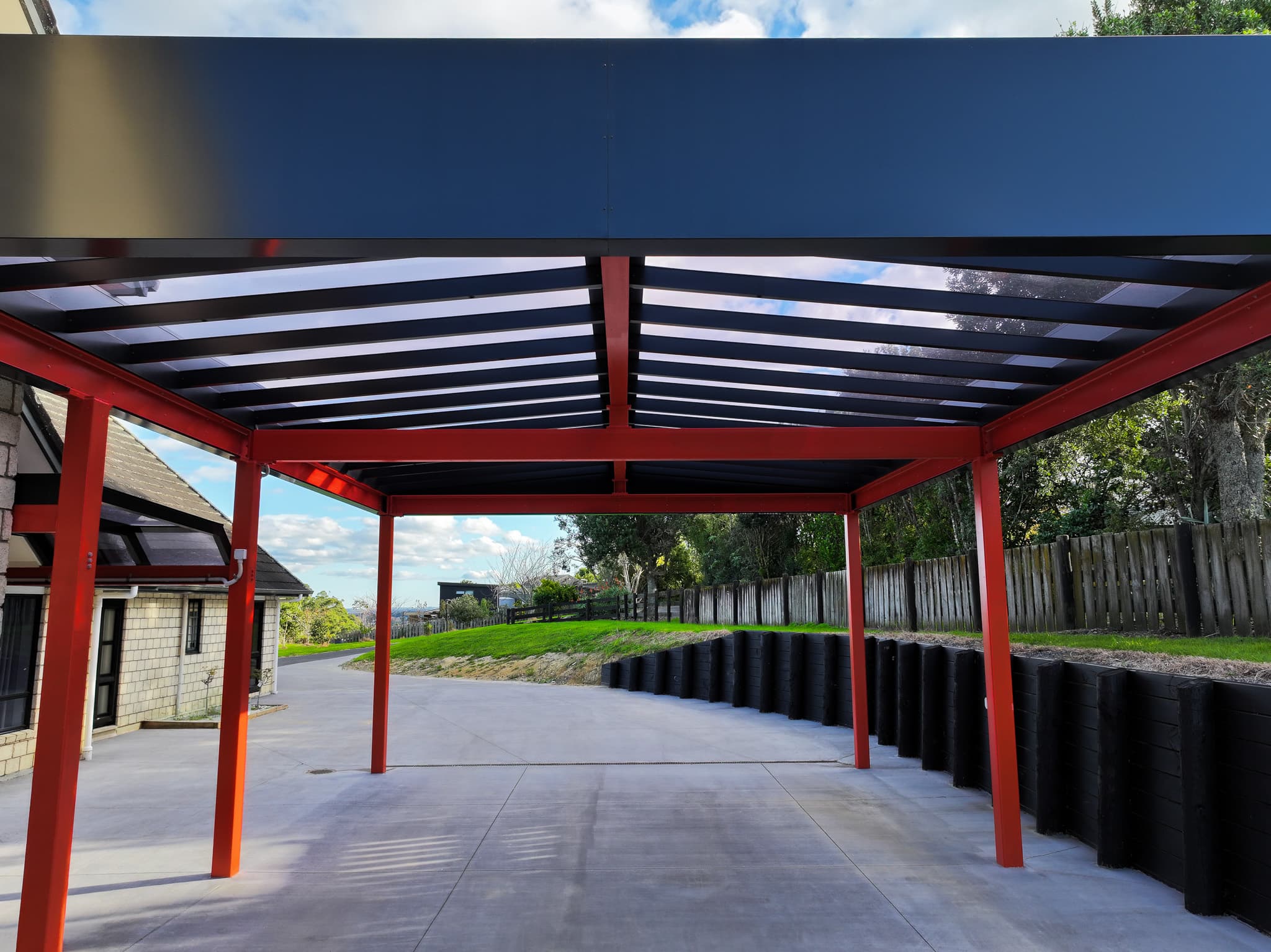 View beneath the Ardmore carport showing the internal gable roof and steel PFC beams