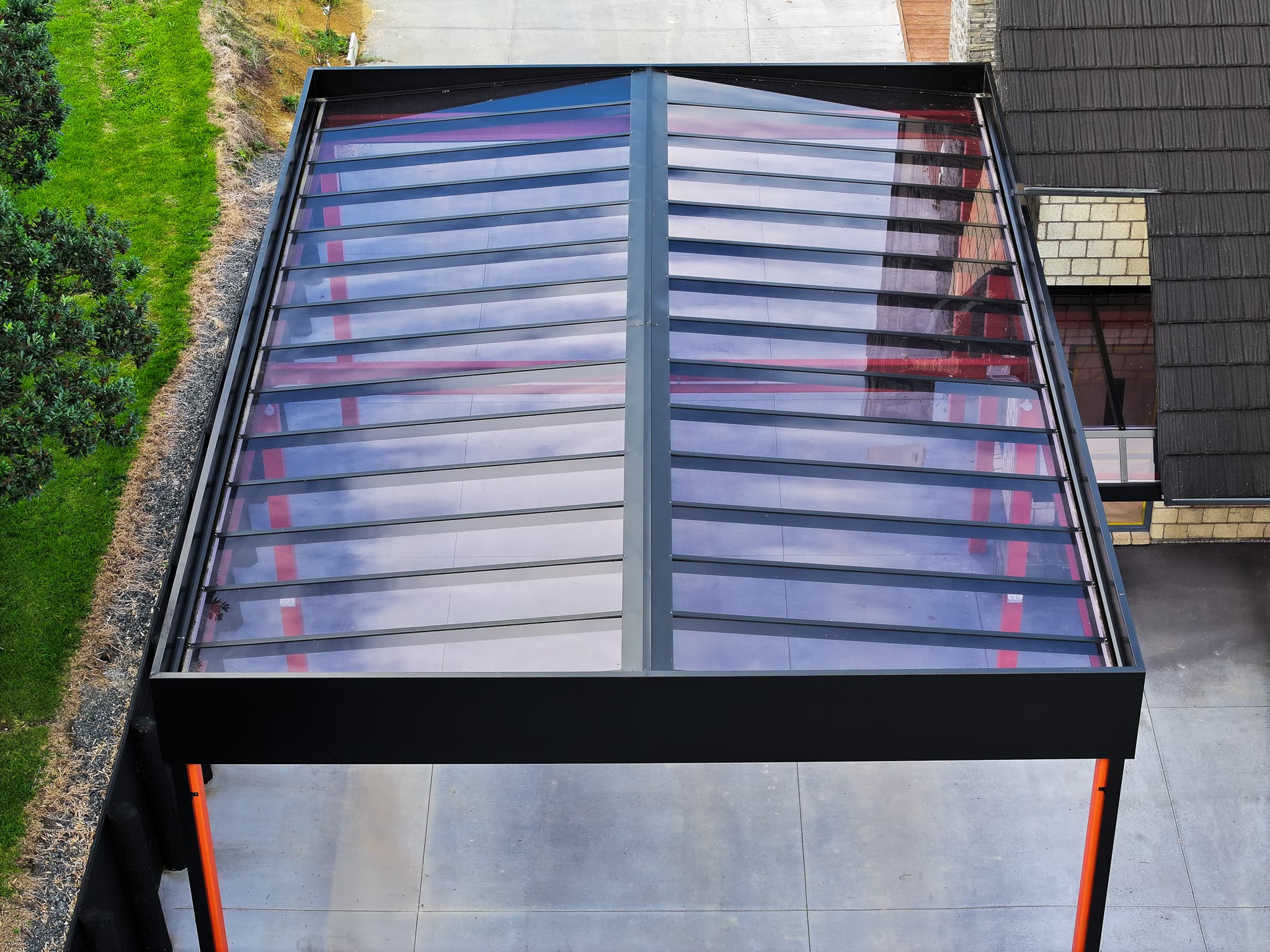 Top-down view of the Ardmore box-perimeter carport roof with gable form inside the frame