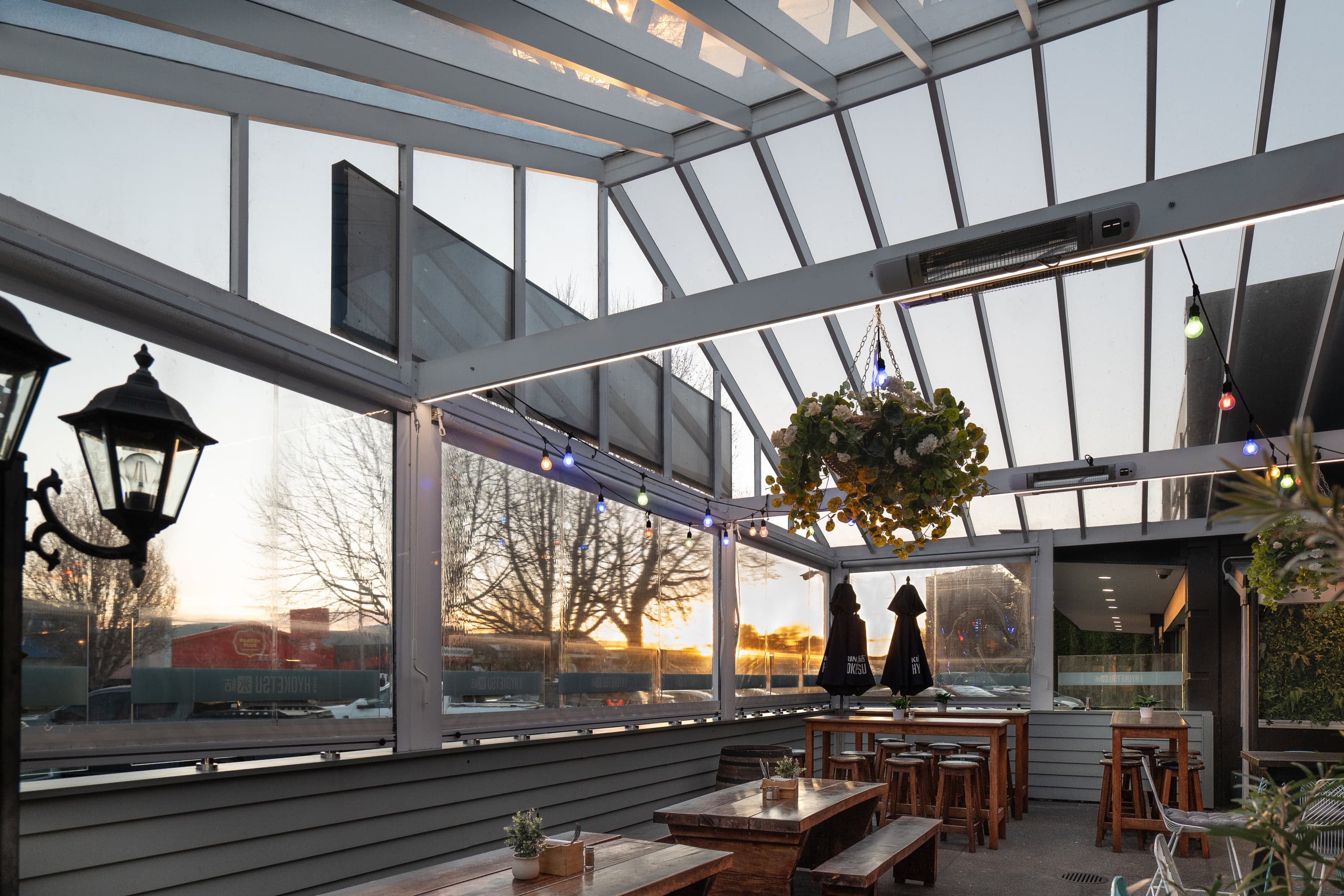 Interior view through The Good Home hospitality courtyard at sunset