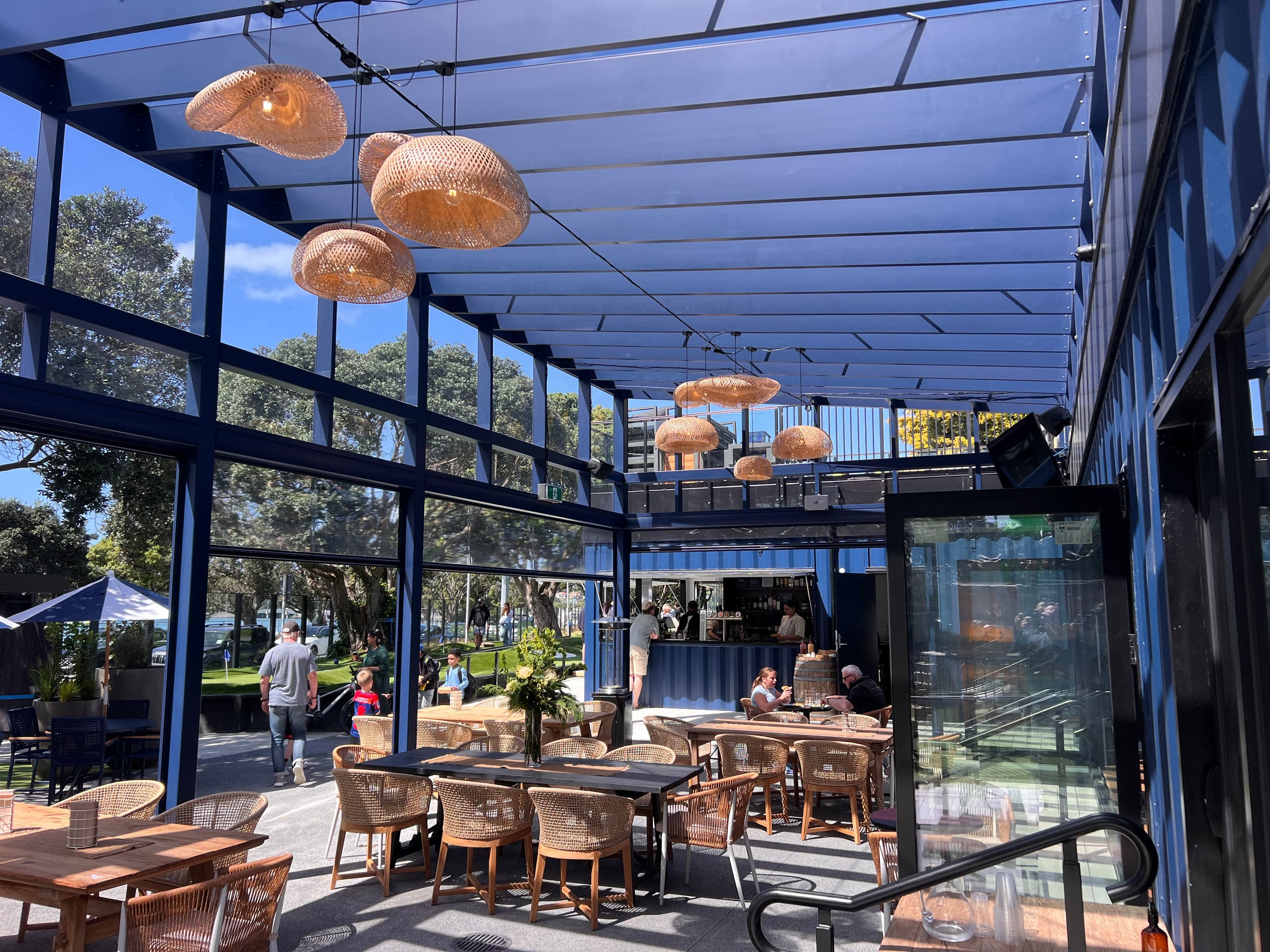 Pergola structure sitting over mini golf seating
