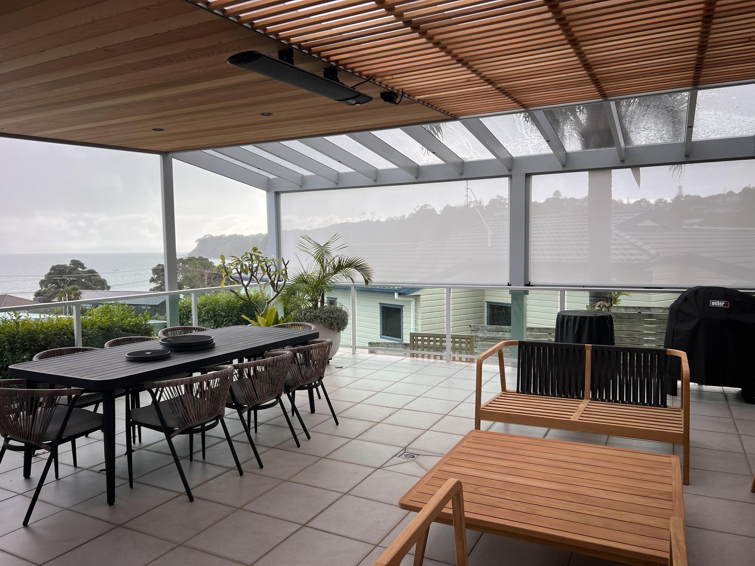 Tindalls Bay patio with dining area, mesh blinds, heater and mixed roof zones